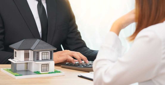 Woman and Man Discussing Mortgage Woman and Man Discussing Mortgage