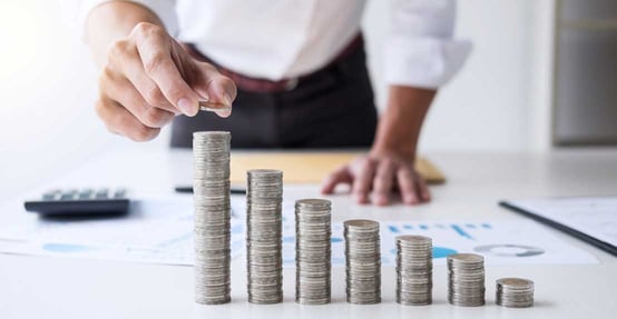 Man Stacking Coins Man Stacking Coins