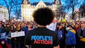 Photo of People's Action representative speaking to a group