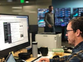Doxo Employee at Computer Doxo Employee at Computer