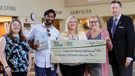 Photo of TLC donating money to community college Photo of TLC donating money to community college