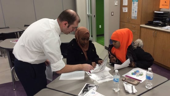 Photo of Kurt Halverson working with two people Photo of Kurt Halverson working with two people