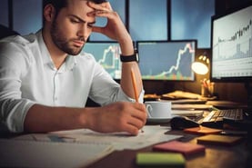 Man Staring at Paperwork Man Staring at Paperwork