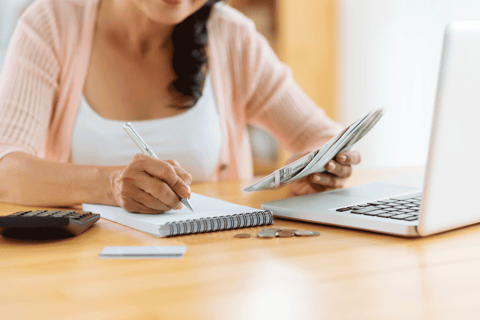 Photo of a woman making a budget