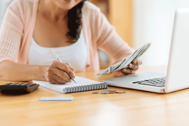 Photo of a woman making a budget Photo of a woman making a budget