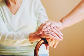 Elderly Woman and Caregiver Hands Elderly Woman and Caregiver Hands