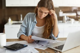 Woman Looking at Finances Woman Looking at Finances