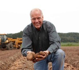 Photo of a farmer with The Farmlink Project 