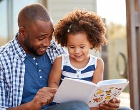 Father and Daughter Doing School Work