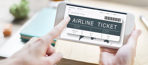 Photo of booking an airline ticket on a phone Photo of booking an airline ticket on a phone