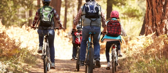 Photo of a family biking Photo of a family biking