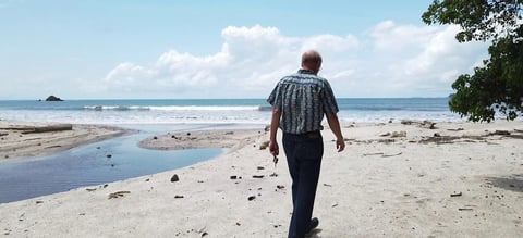 Photo of a man walking on the beach in Panama