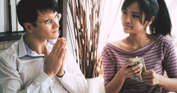 Photo of a man asking to borrow money from a woman Photo of a man asking to borrow money from a woman
