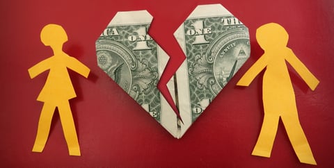 Photo of paper figures and two dollar bills. Photo of paper figures and two dollar bills.