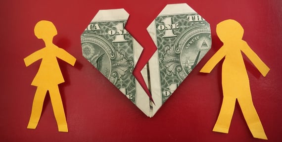 Photo of paper figures and two dollar bills. Photo of paper figures and two dollar bills.