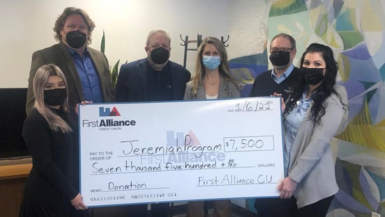 Photo of check presented to the Jeremiah Program Photo of check presented to the Jeremiah Program