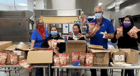 Image of RBFCU event donating baking supplies Image of RBFCU event donating baking supplies