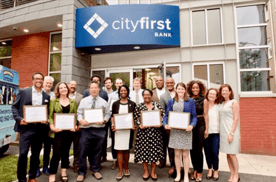 Image of City First Bank Employees recognizing 11 nonprofit partners