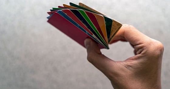 Hand holding several credit cards Hand holding several credit cards