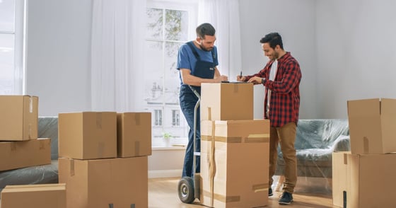 Two men with moving boxes Two men with moving boxes