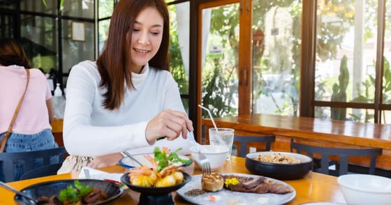 Brunette woman eating at a restaurant Brunette woman eating at a restaurant