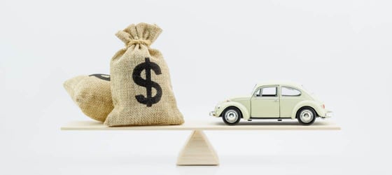 Auto loan or transforming assets into cash concept : Car model, US dollar notes in jute bags on simple balance scale, depicts car owner or borrower turns personal properties into cash or wealth Auto loan or transforming assets into cash concept : Car model, US dollar notes in jute bags on simple balance scale, depicts car owner or borrower turns personal properties into cash or wealth