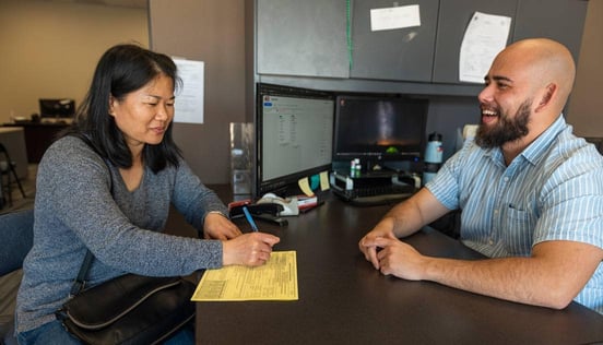 Photo of volunteer with a tax filer