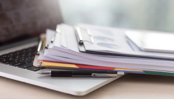 Business documents to graph financial success. Business documents to graph financial success.