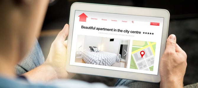 Man searching for an apartment on a tablet