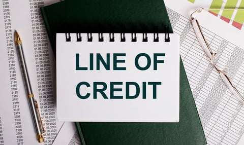 Line of credit printed on a notebook graphic