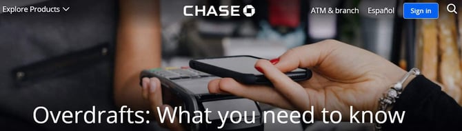 Chase overdraft ad featuring hand holding a phone to make a purchase Chase overdraft ad featuring hand holding a phone to make a purchase