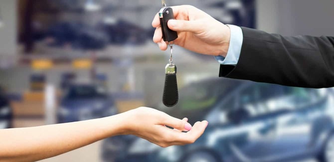 transferring car keys in a car dealership transferring car keys in a car dealership