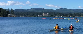 Kayakers off the shores of Kitsap Peninsula Kayakers off the shores of Kitsap Peninsula