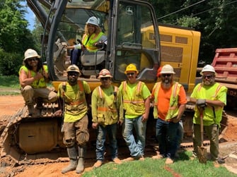 Georgia Rep. Lucy McBath with workers at Garney Construction