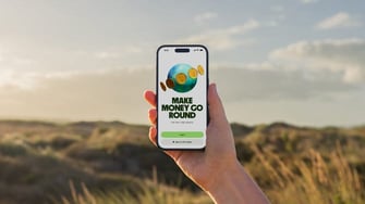 Wise on phone being held aloft in nature