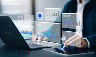 a man looking at data insights on laptop a man looking at data insights on laptop