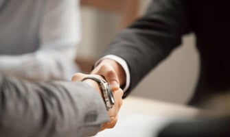 a photo of two people shaking hands