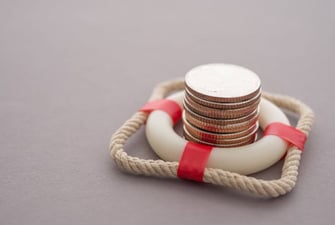 tiny life raft surrounding coins graphic tiny life raft surrounding coins graphic