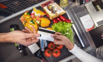 a person using a credit card to grocery shopping graphic a person using a credit card to grocery shopping graphic