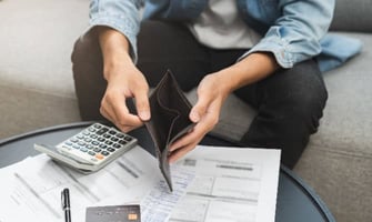 a man holding an empty wallet graphic a man holding an empty wallet graphic