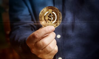 a man holding a stablecoin graphic a man holding a stablecoin graphic