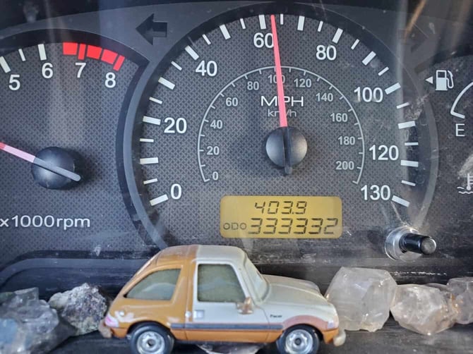 Close Up Photo of a High Mileage Odometer in a Car
