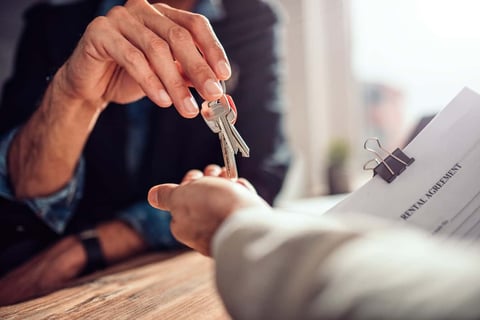 Landlord Handing Keys To Renter Landlord Handing Keys To Renter
