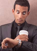 Man checking watch, late on credit card payment Man checking watch, late on credit card payment