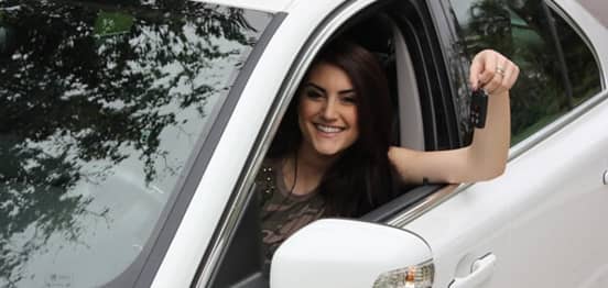 Photo of a woman in a new car Photo of a woman in a new car