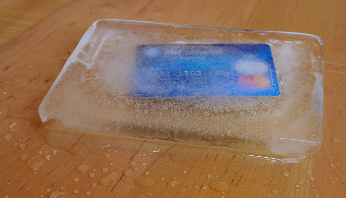 Image of a credit card in a block of ice Image of a credit card in a block of ice