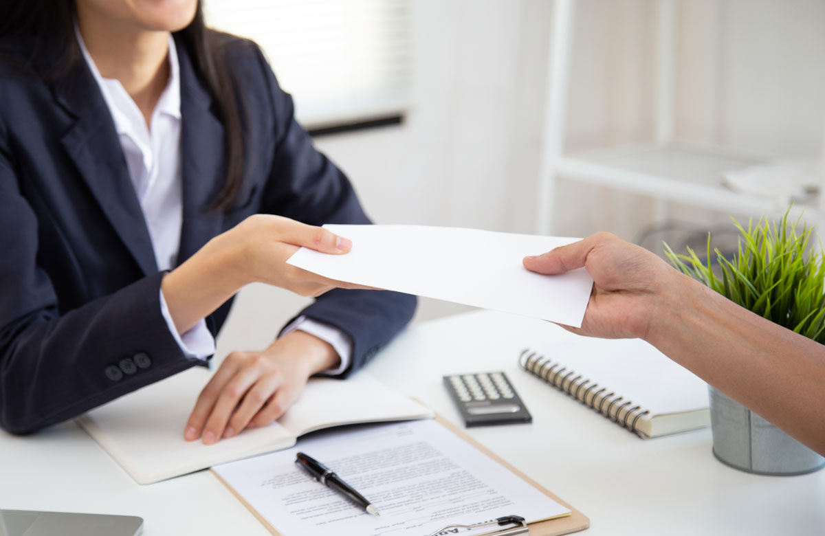 Photo of an Employer Handing Over a Check Photo of an Employer Handing Over a Check