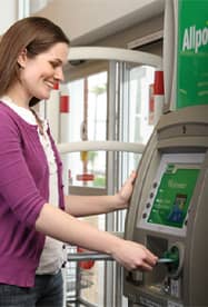 Photo of a Woman Using an Allpoint ATM Photo of a Woman Using an Allpoint ATM