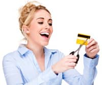 Woman cutting up credit card