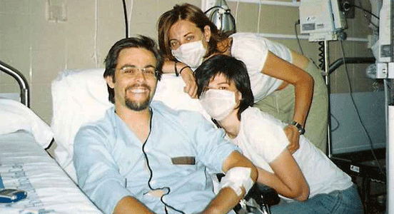 Photo of a family smiling at a hospital from the Good News Network site Photo of a family smiling at a hospital from the Good News Network site